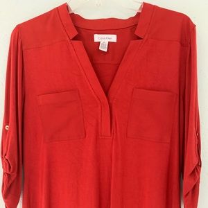 Calvin Klein rust pull over blouse.